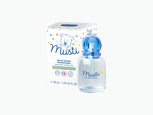 Caja del agua perfumada de Mustela y a su derecha el bote de cristal. - solucionesbanohub.compaña - 4